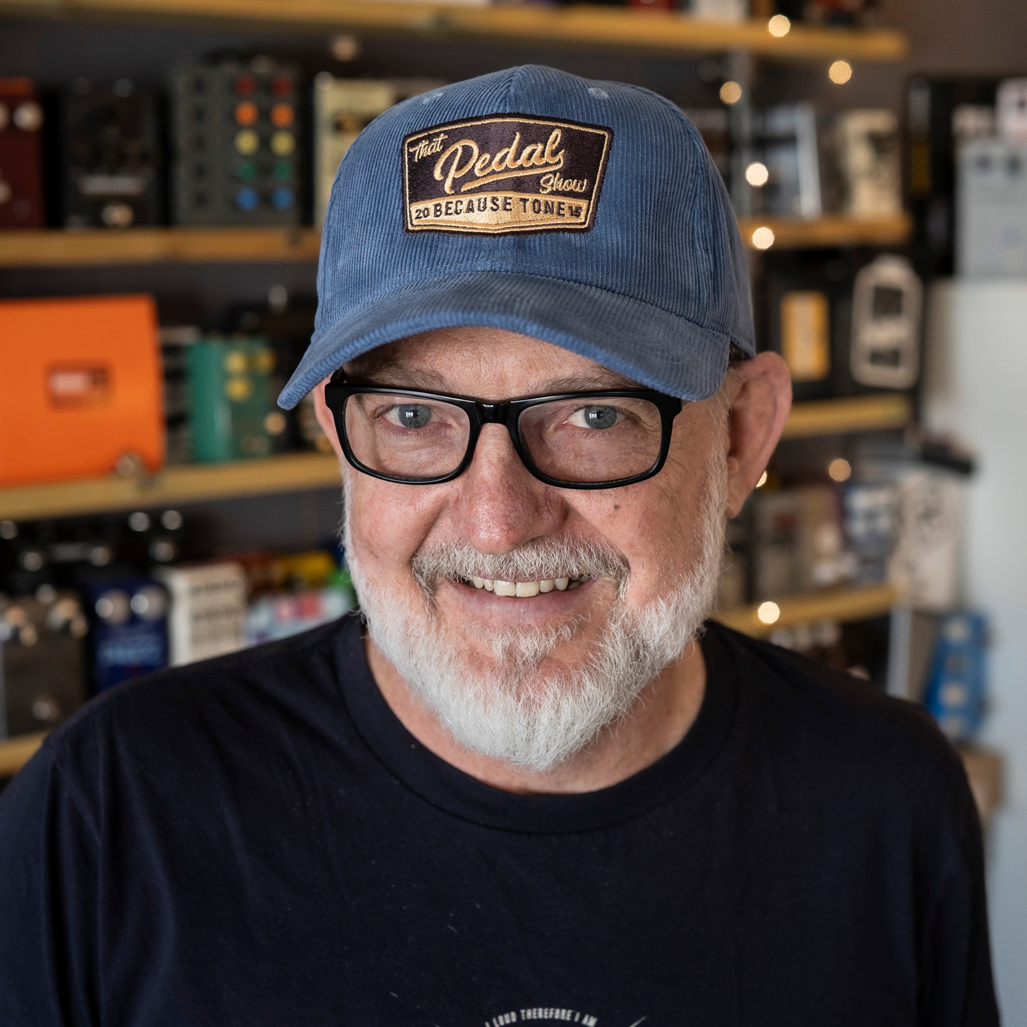 Dan wears Slate Blue corduroy baseball cap with vintage That Pedal Show logo embroidered onto front.