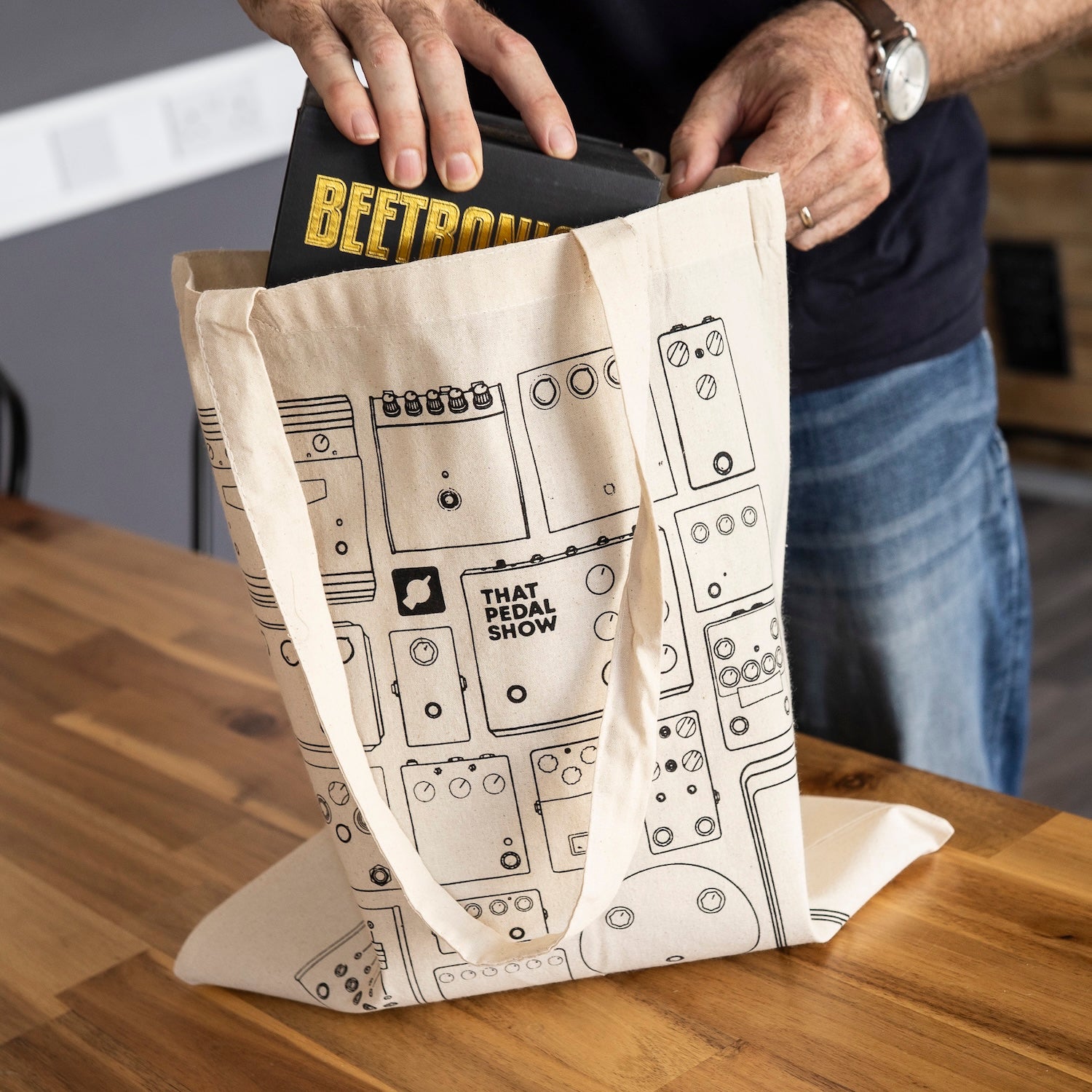Dan stashes some guitar pedals in his Tote of Tone cotton tote bag.