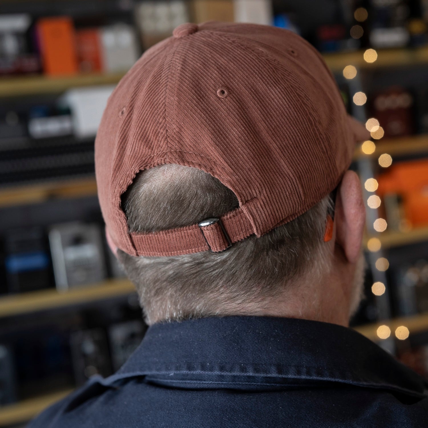 Back of cord baseball cap, showing size adjustment.